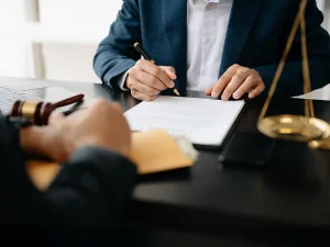 Florida criminal defense lawyer reviewing evidence and paperwork with a client in the office during discussion of suppressing video surveillance evidence