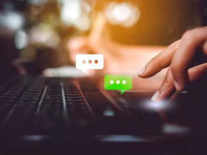 Person using laptop and smartphone with chat bubbles, symbolizing discussion of reasonable criminal sentences in Florida